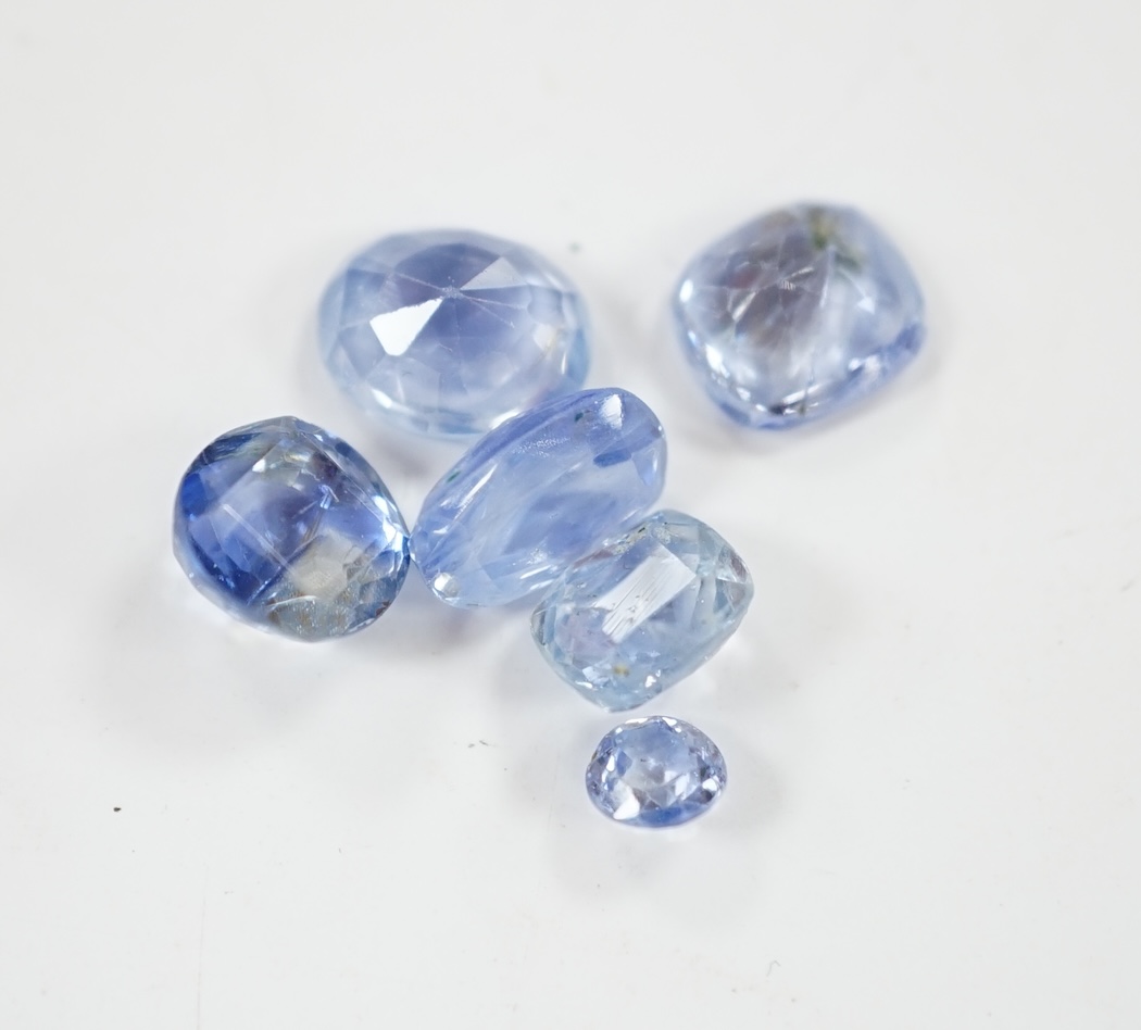 A group of ten cut unmounted pale blue sapphires, total carat weight approximately 15.1ct. Condition - fair